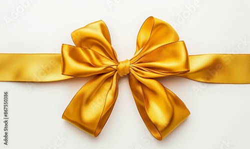 a gold Christmas bow isolated on whie background © SRENStock