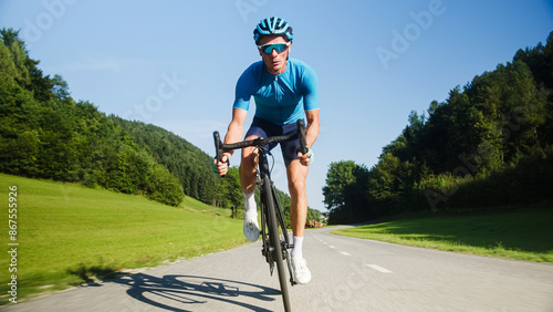 Konstfotografi Athlete man in cycling blue jersey and gear, riding a professional racing cycle