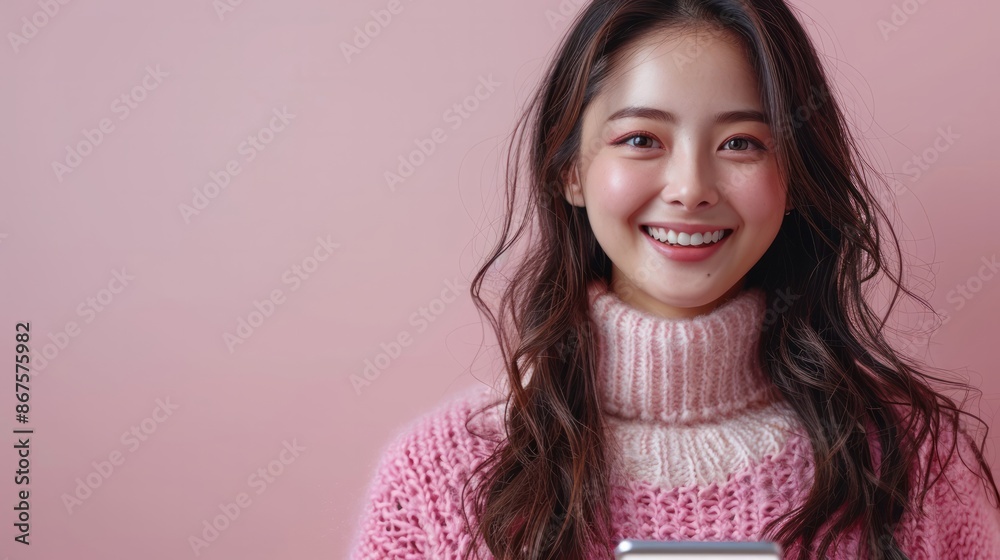 Asian woman using mobile phone with tablet and excited about online shopping while smiling.