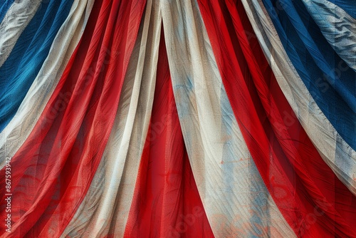 Close-up of red, white, and blue fabric with a draped texture. photo