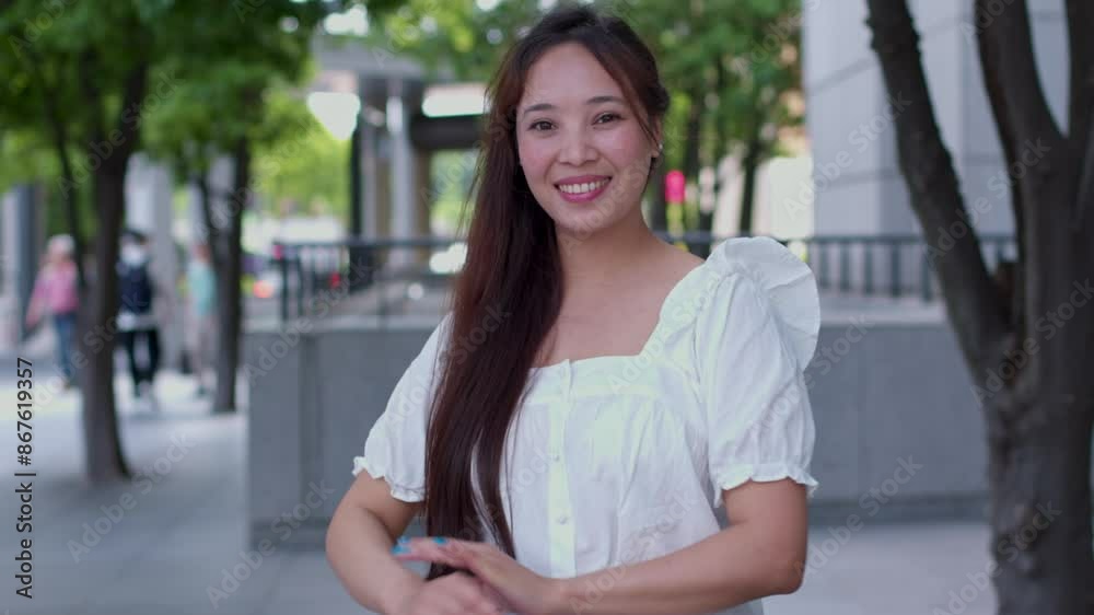 Ethnic diversity concept, portrait of confident mixed race woman of Japanese and Indian ethnicity , looking at camera, smiling, street headshot of a girl of mixed ethnicity Ethnic diversity concept, portrait of confident mixed race woman of Japanese and Indian ethnicity , looking at camera, smiling, street headshot of a girl of mixed ethnicity