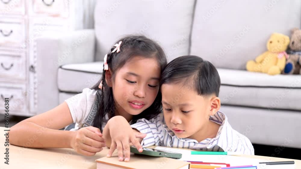 Addicted laptop video games online internet modern technology little sibling children watching together sitting on floor, happy emotional Asian boy and girl kids have fun leisure bonding relationship Addicted laptop video games online internet modern technology little sibling children watching together sitting on floor, happy emotional Asian boy and girl kids have fun leisure bonding relationship
