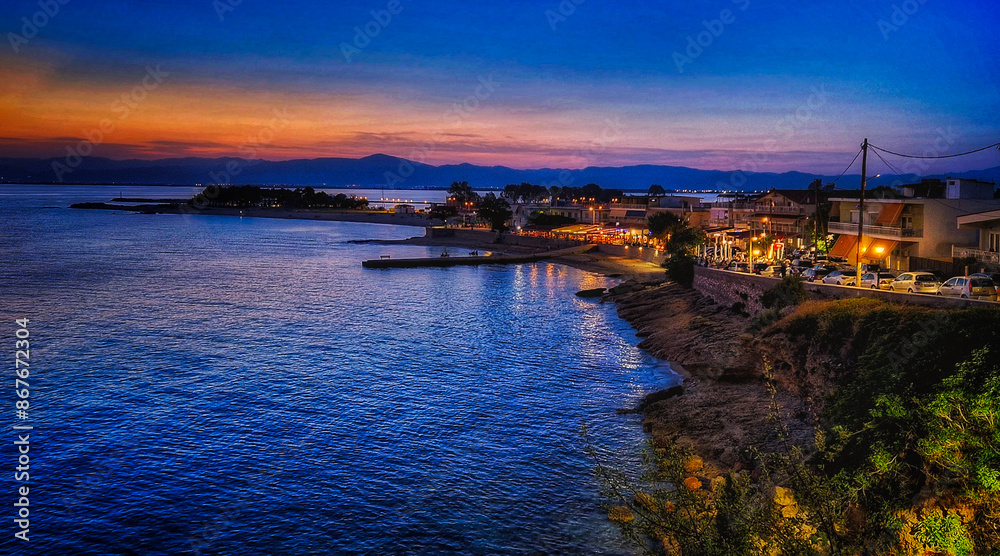 coast and beach at the port of Fanari, Greece, during the blue hour coast and beach at the port of Fanari, Greece, during the blue hour