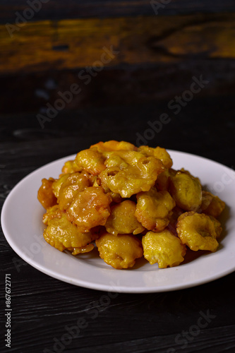 Sweet emping is a type of snack or snack made from melinjo or belinjo seeds. Sweet Emping has a slightly bitter and sweet taste due to the addition of sugar caramel. photo