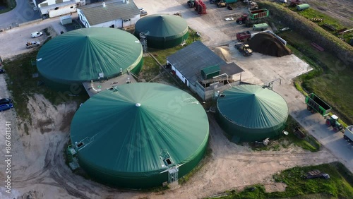 Drone flight view, over biogas production plant. Obtaining biogas, biomethane, from household, agricultural and food industry waste. Renewable energy from biomass. High quality 4k footage