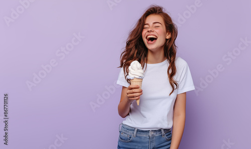 Happy girl with ice cream on a lilac background.