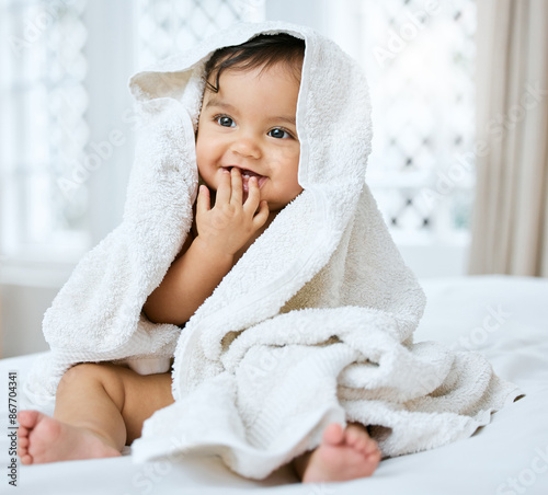 Obraz na płótnie Baby, smile and towel on bed for hygiene with bath time, child skincare and wellness for growth in home