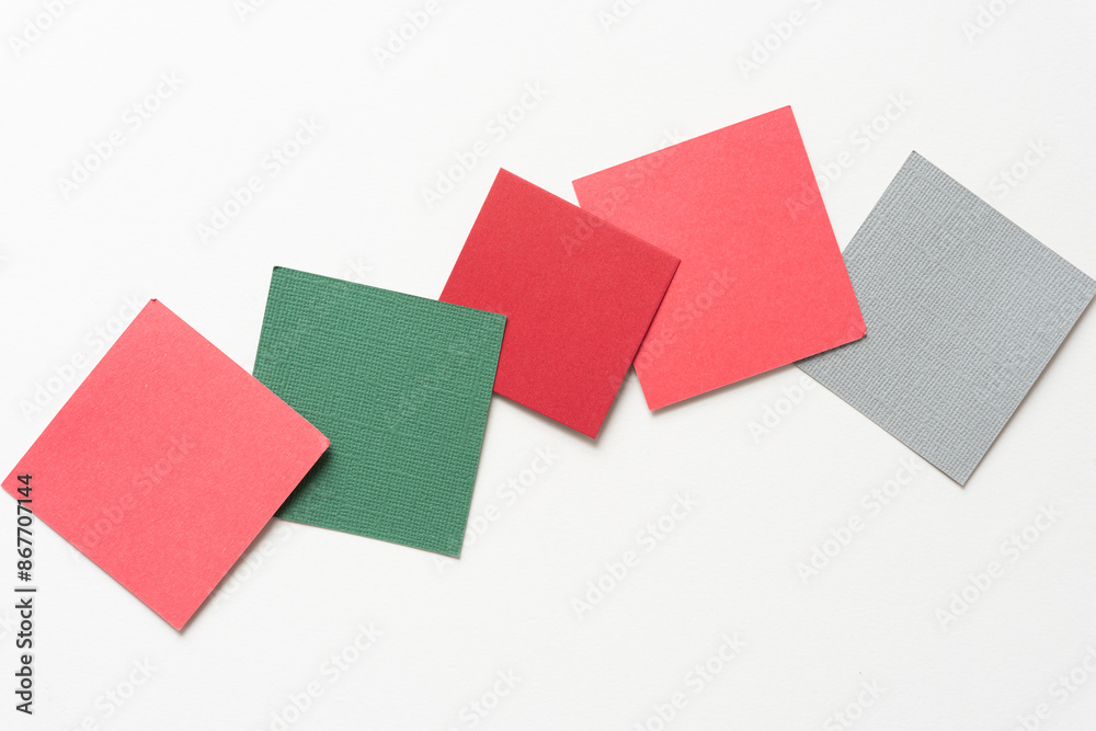 five paper squares partly overlapping on blank paper five paper squares partly overlapping on blank paper