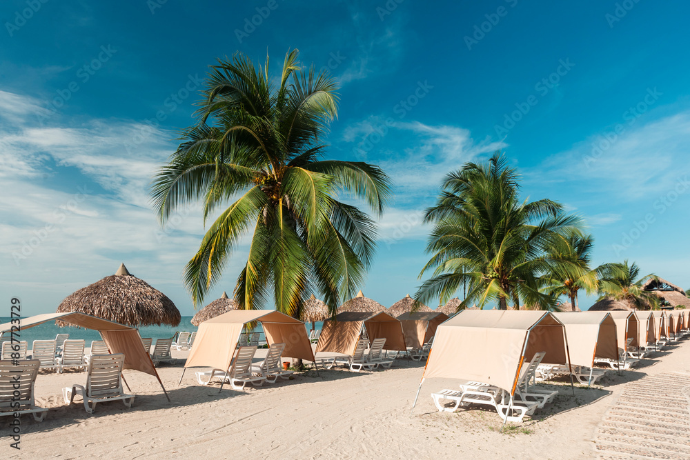 Portrait on the beach with blue sky and umbrellas with chairs to rest. Panama. Portrait on the beach with blue sky and umbrellas with chairs to rest. Panama.