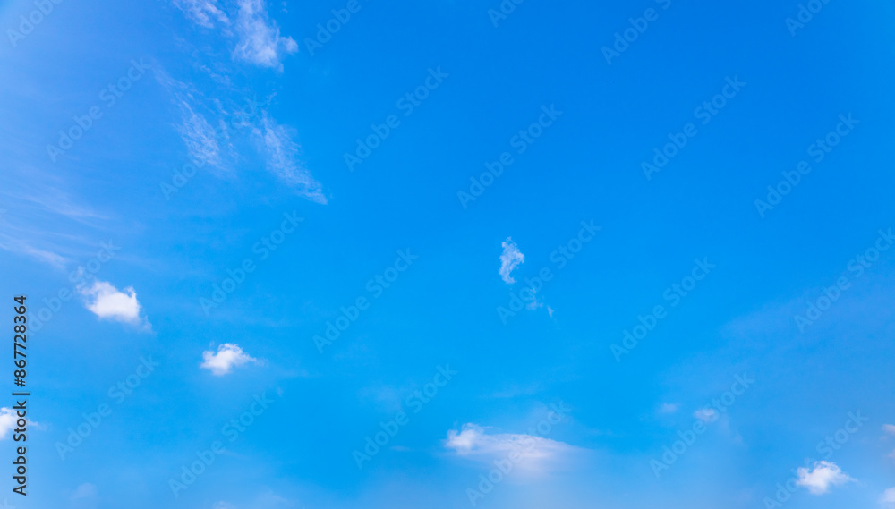 Beautiful blue sky and white fluffy group of clouds background in the morning skyline Beautiful blue sky and white fluffy group of clouds background in the morning skyline