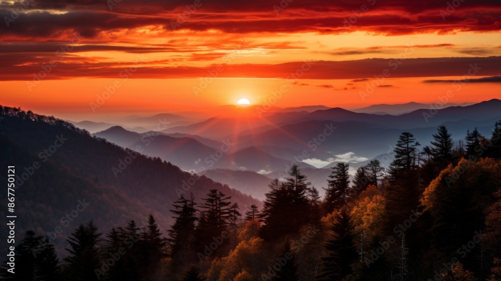 A mesmerizing sunset over a forested mountain range, with layers of mountains and a densely forested horizon, capturing the beauty and tranquility of nature.