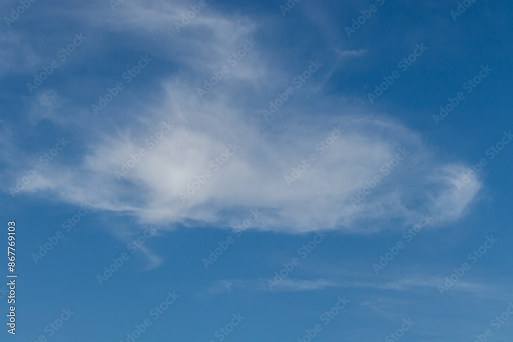 White clouds against a blue sky White clouds against a blue sky