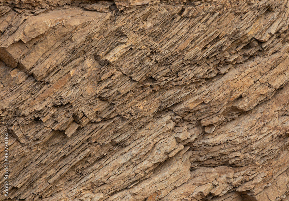 Naklejka premium Layered sand coloured stone textures background