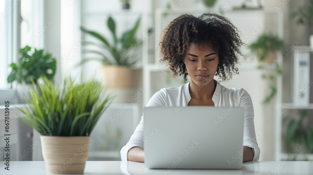Woman working on a laptop / Women in business / Small business owner Woman working on a laptop / Women in business / Small business owner