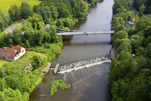 The Stadleck chain bridge over the Luznice river stands below the town of Stadlec and is the last surviving Empire chain bridge in the Czech Republic. It was built in 1847-1848. photo