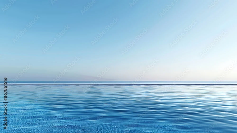 Obraz premium A luxurious infinity pool overlooking a serene ocean, with the water reflecting the clear blue sky