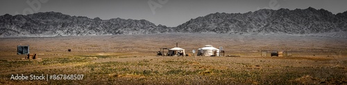 Nomadic settlement in the Mongolian steppe. It's amazing how these people live their lives here in this landscape, which already resembled a desert photo