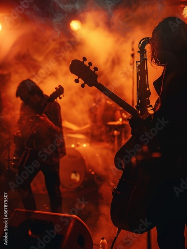 A silhouetted guitarist plays on stage in front of an orange-lit crowd. The stage is filled with smoke and spotlights. Generative AI