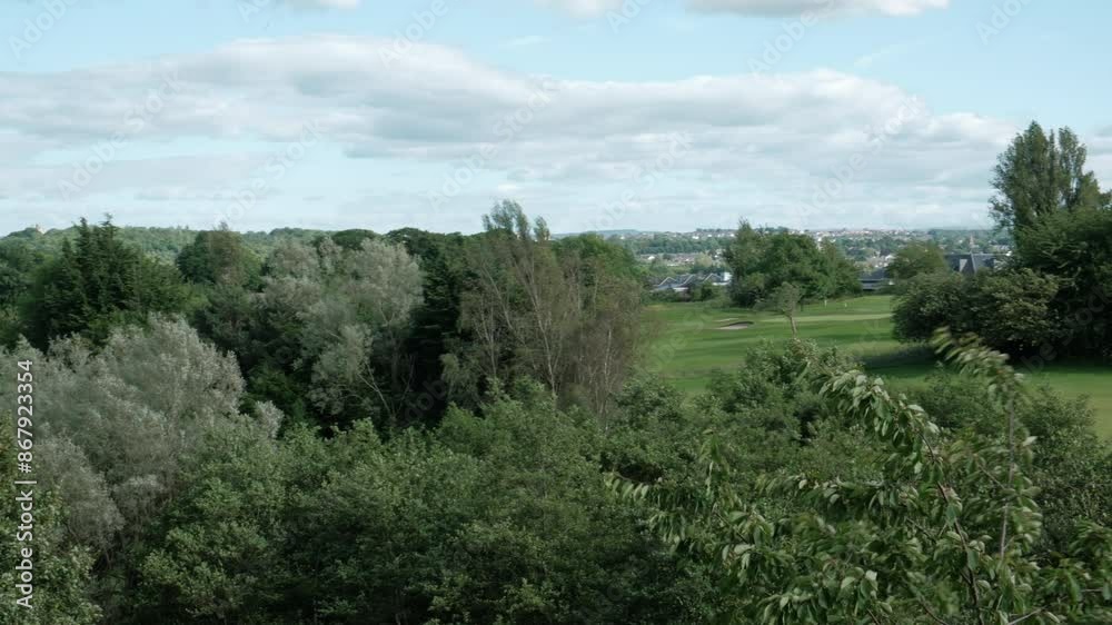EDINBURGH - JUNE 24, 2024: A scenic view of the nature surrounding Duddingston Low Road in Edinburgh, Scotland.