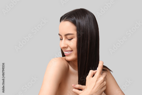 Young woman with cosmetics ...