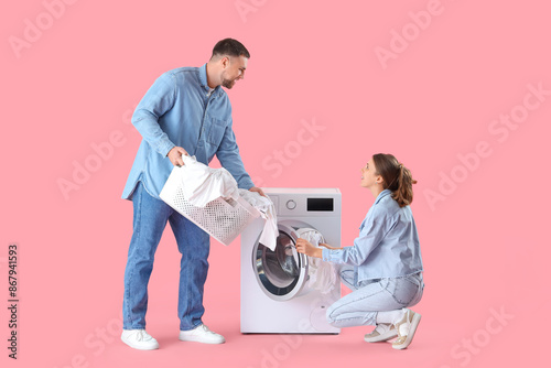 Young couple doing laundry ...