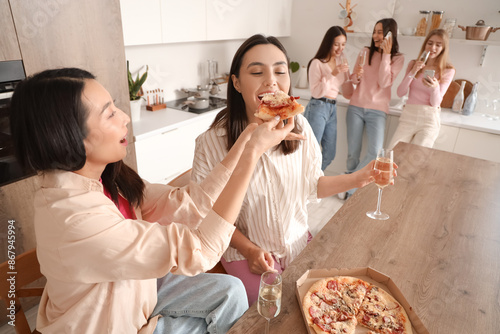 Young women with champagne ...