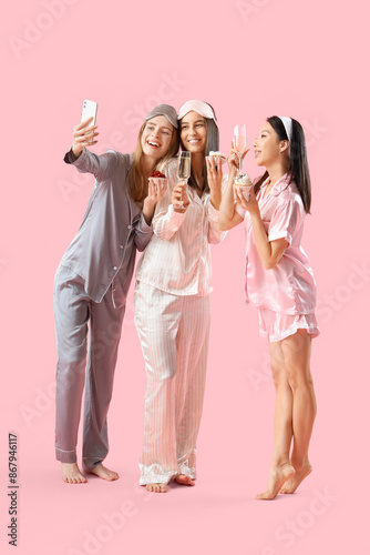 Young women in pajamas with...