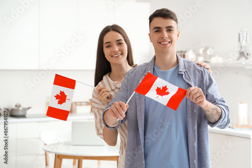 Young couple with flags of ...