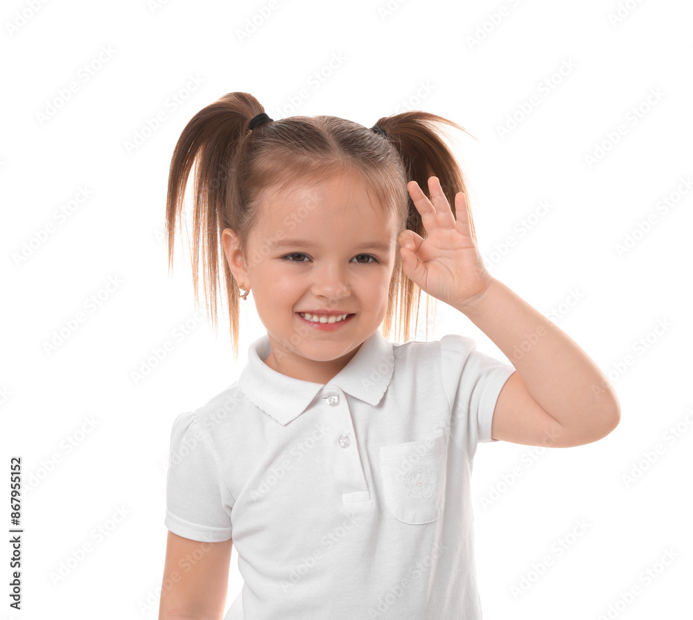Portrait of happy little girl showing OK gesture on white background Portrait of happy little girl showing OK gesture on white background