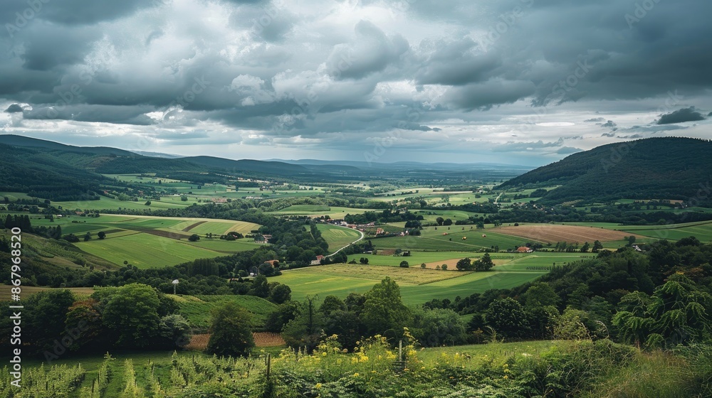 Valley with lush farms under cloudy sky plenty of room for text Valley with lush farms under cloudy sky plenty of room for text
