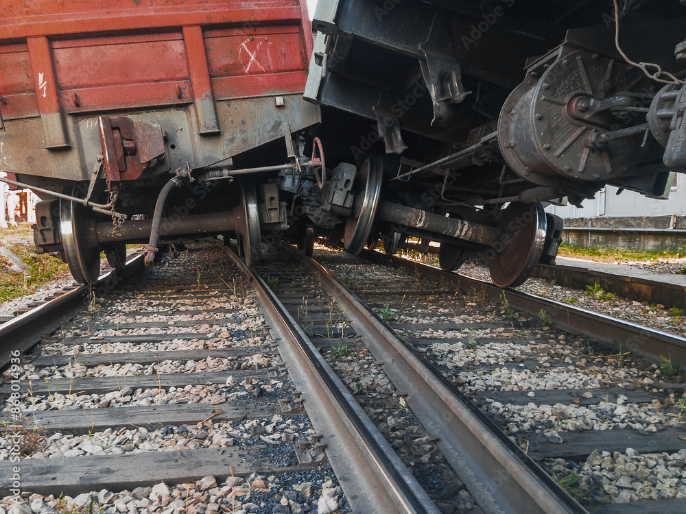 The wreck of railway wagons. An accident on the railway. A railway carriage derailed during daylight hours. The railway car as a result of the accident came off the rails. The wreck of railway wagons. An accident on the railway. A railway carriage derailed during daylight hours. The railway car as a result of the accident came off the rails.