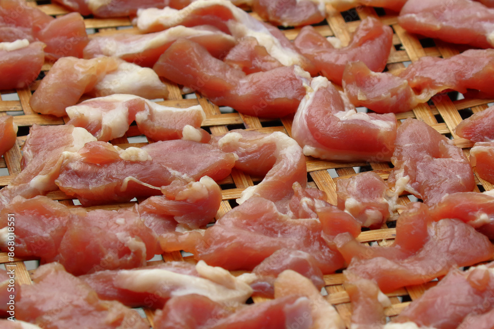 Fresh pork pieces that are dried in the sun for cooking. Food preservation Fresh pork pieces that are dried in the sun for cooking. Food preservation