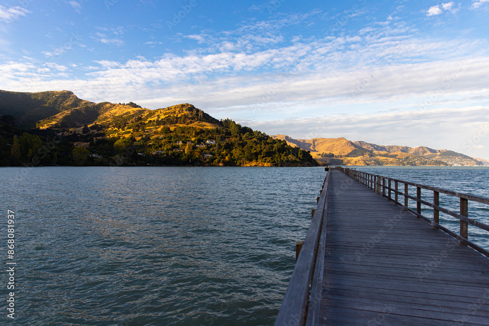governors bay jetty at sunset; new zealand south island, canterbury region, little bay between lyttelton and banks peninsula governors bay jetty at sunset; new zealand south island, canterbury region, little bay between lyttelton and banks peninsula