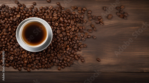 Enjoy a cup of freshly brewed coffee on a rustic wooden table surrounded by scattered coffee beans.