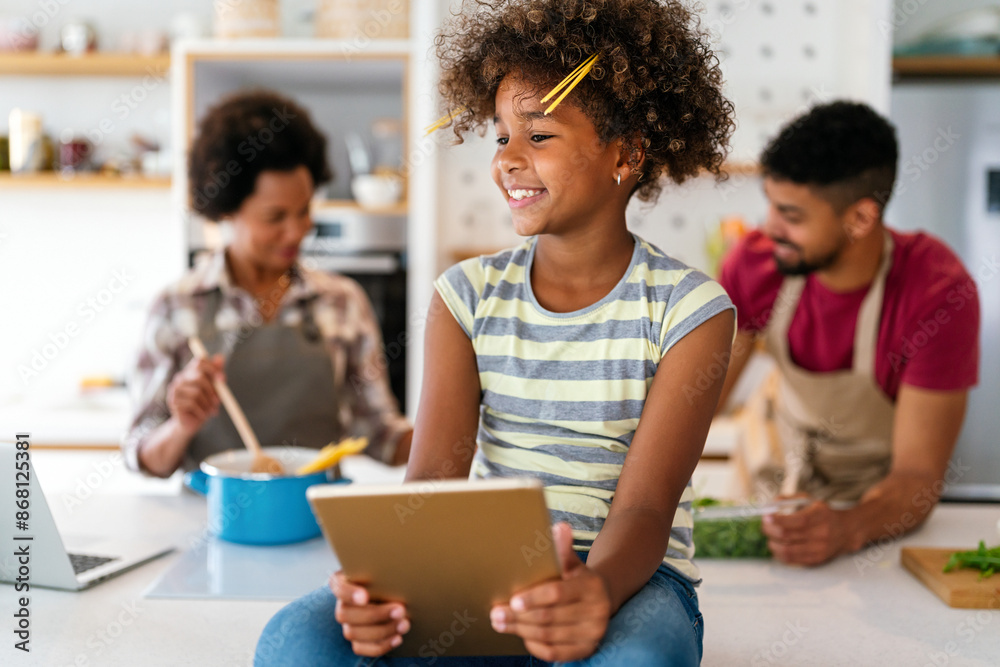 Happy smiling african american parents enjoy weekend play with child in kitchen. Family love concept Happy smiling african american parents enjoy weekend play with child in kitchen. Family love concept