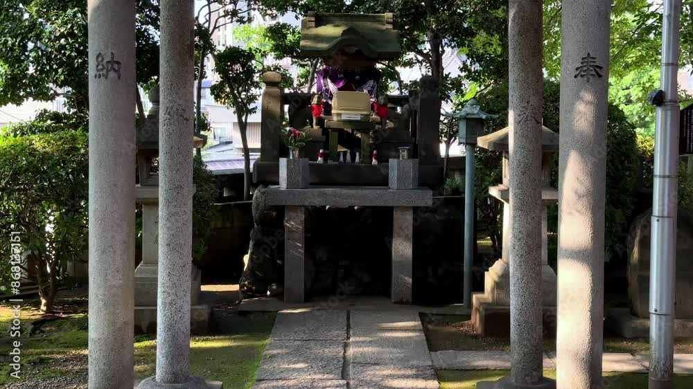 Japanese shrine entrance with stone pillars and moss-covered path, daylight, tranquil setting Japanese shrine entrance with stone pillars and moss-covered path, daylight, tranquil setting
