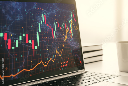 Modern computer display with abstract financial graph with world map, financial and trading concept. 3D Rendering © Pixels Hunter