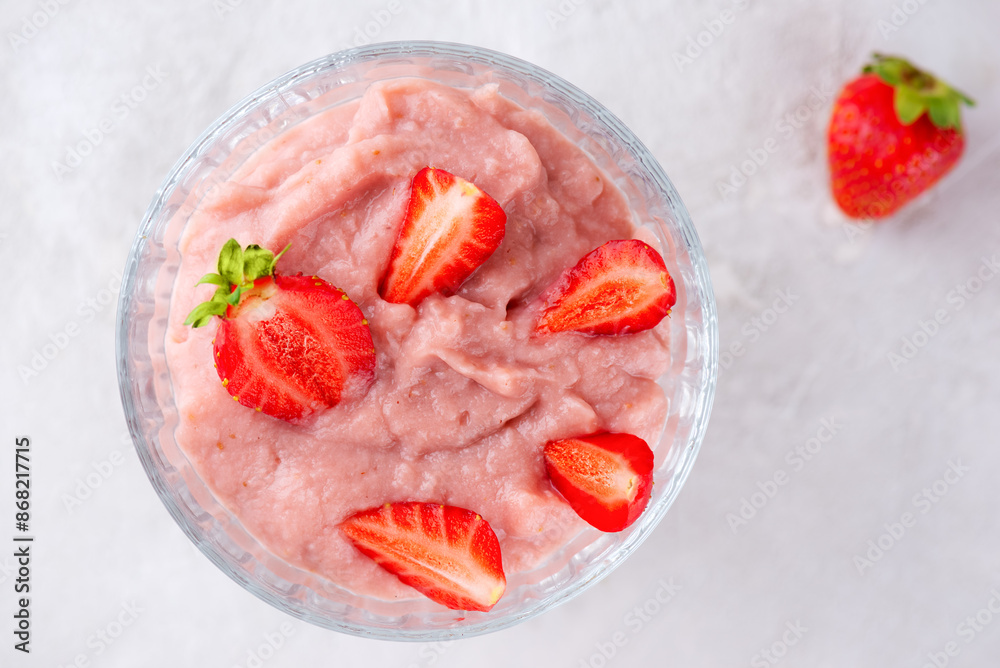 Tofu soy strawberry yogurt dessert in a glass. Vegan, homemade. Lactose and sugar free. Top view. Tofu soy strawberry yogurt dessert in a glass. Vegan, homemade. Lactose and sugar free. Top view.