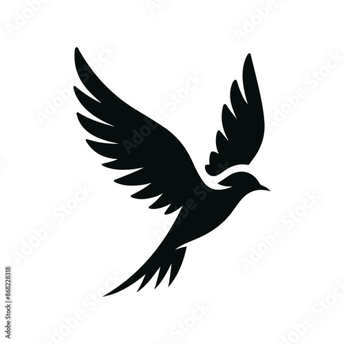 A black bird with white wings is flying in the air.