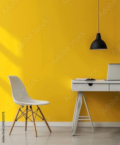 Clean lines and a yellow wall in a minimalist home office