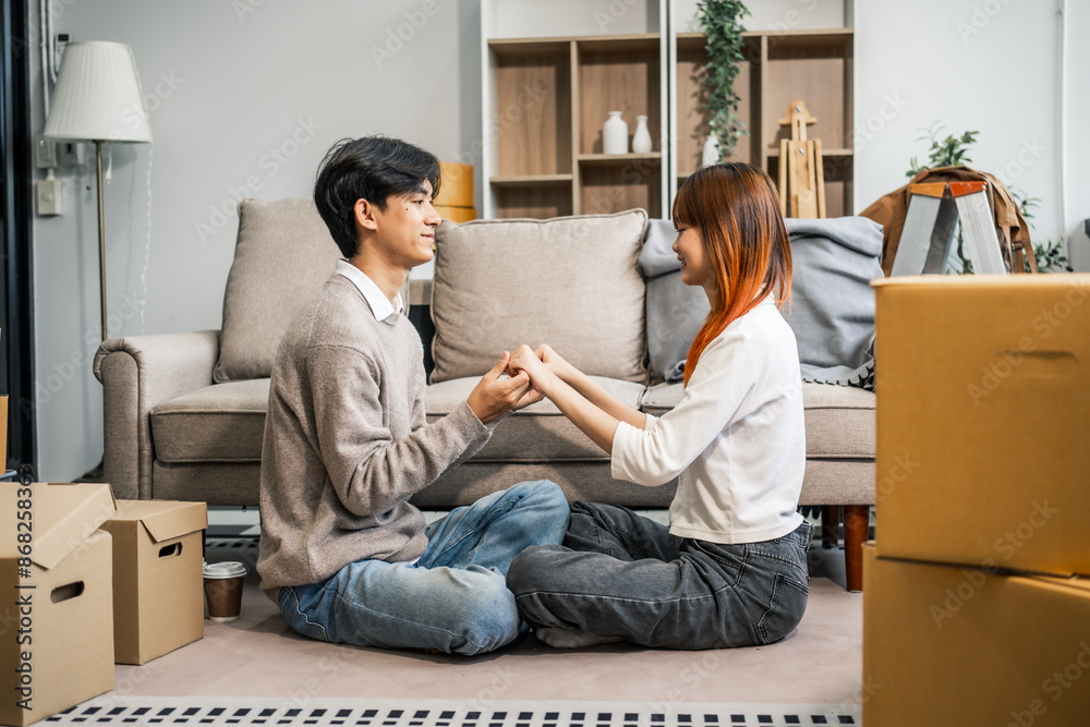 A stressed young couple faces financial challenges, struggling with debt and bills. Despite the hardships, they turn to each other for support, holding hands and confronting their issues together. A stressed young couple faces financial challenges, struggling with debt and bills. Despite the hardships, they turn to each other for support, holding hands and confronting their issues together.