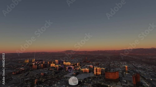 Circular aerial drone shot at sunset of Downtown Las Vegas city in Nevada. United States