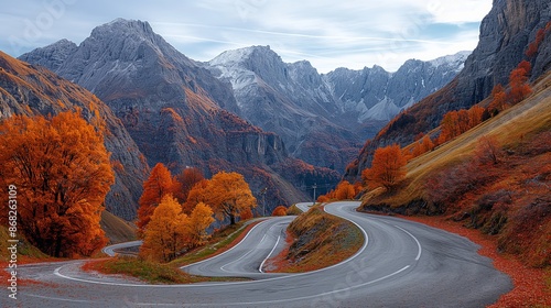 Serene Autumn Beauty: Scenic Stelvio Pass, Italy, with Curving Road and Vibrant Foliage photo