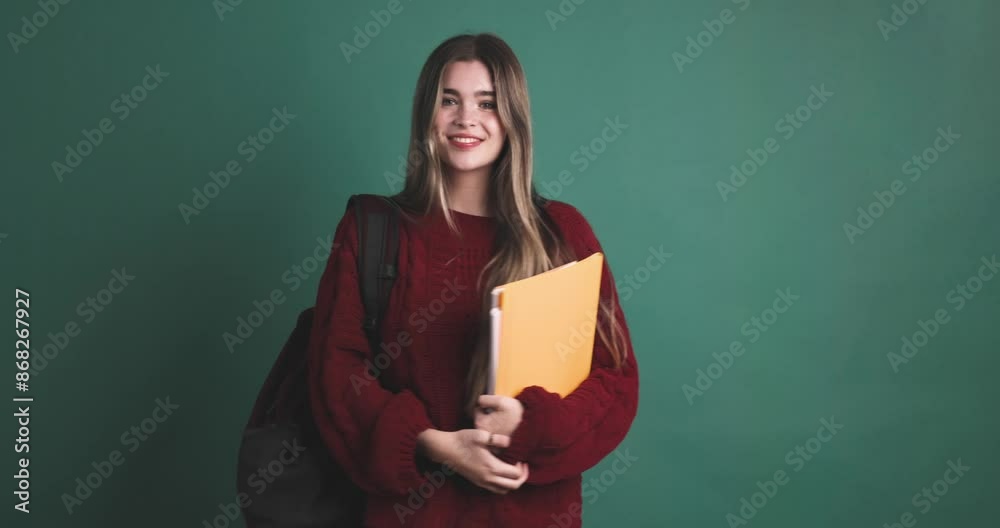 Happy young woman student standing with books Happy young woman student standing with books