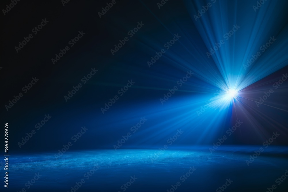 © volga - Dark stage with a single bright spotlight