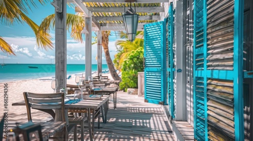 beachfront bistro with bright blue Bahama shutters, setting a relaxed mood for diners by the sea © Ramzan