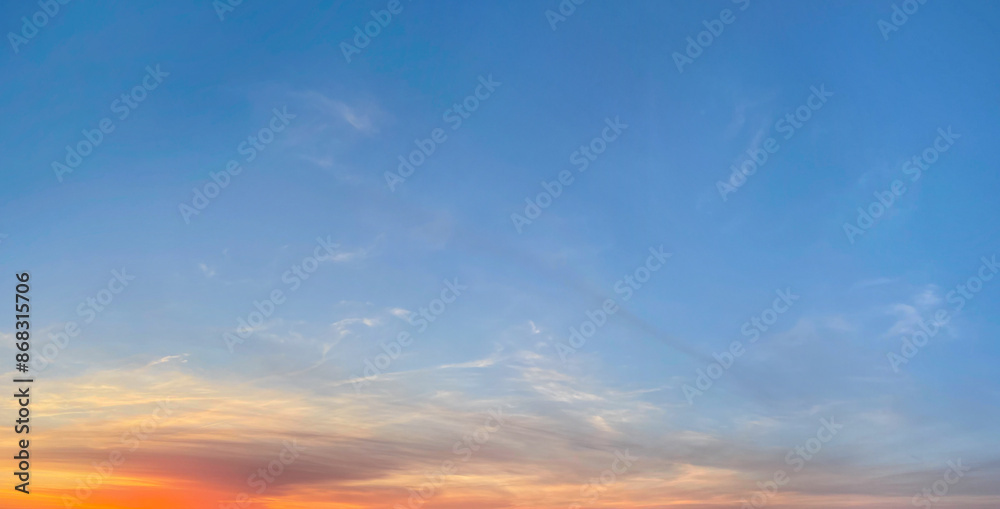 Fototapeta premium Blue sunrise sky with gold and red sunlight. Skym sun and cloud, outdoors weather background