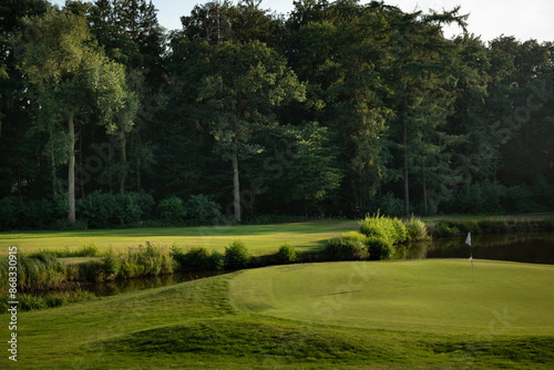 Golf course in green field