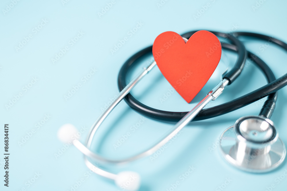 Stethoscope symbolizes essential medical care provided within health care system, health insurance plays crucial role in financing treatment and medicine to disease, concept of health management.