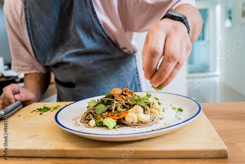 Wallpaper Mural Chef at the kitchen preparing japanese buckwheat pasta with lentils Torontodigital.ca